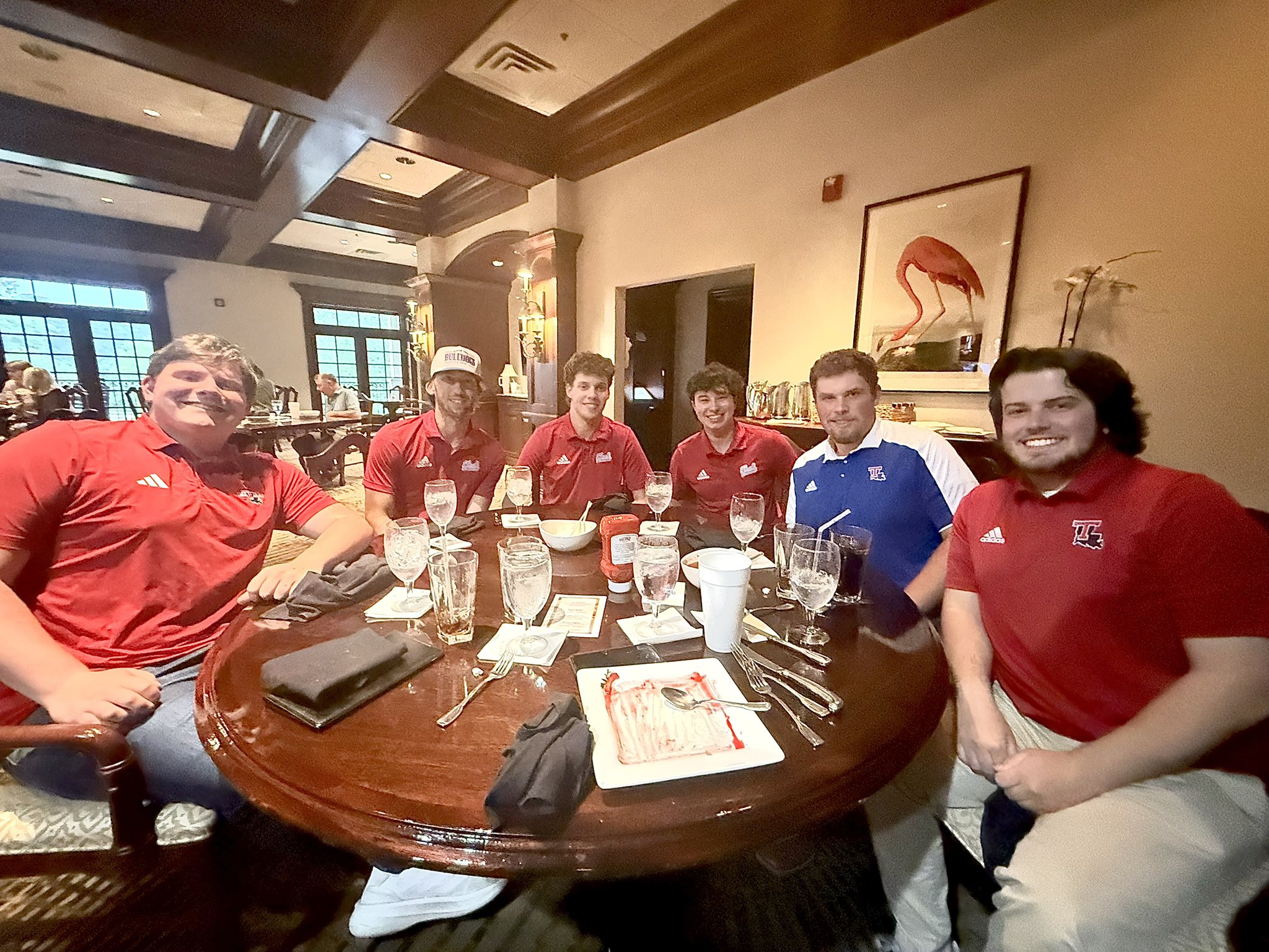 Blue Bloods members at dinner with the athletic director