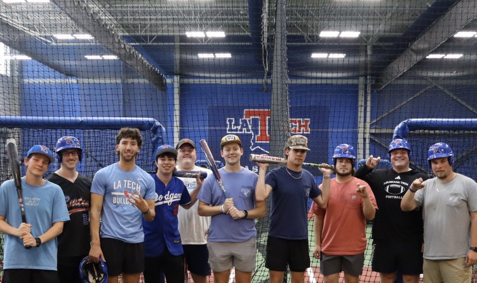 Blue Bloods members taking part in batting practice at the Love Shack